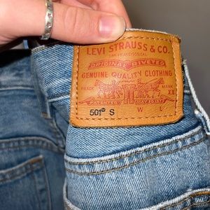 Levi’s 501 Skinny, blue ripped jeans